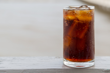 Cola with ice in the glass ready to drink for refresh on blur backgroundの写真素材