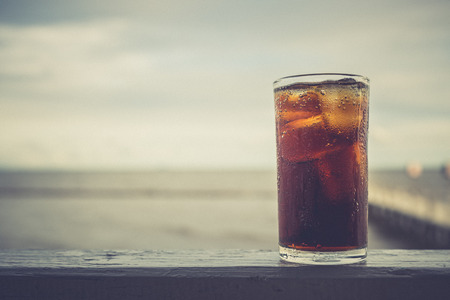 Cola with ice in the glass ready to drink for refresh on blur backgroundの写真素材