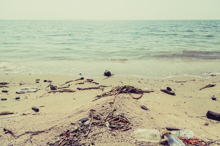 Plastic junk garbage dirty on the beach environment pollution backgroundの写真素材