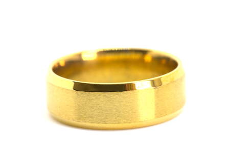 Close up of gold rings for wedding of bride and groom isolated on white backgroundの写真素材