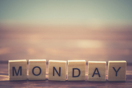 Alphabet Monday on old vintage wood backgroundの写真素材