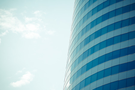 Modern office building with glass reflection backgroundの写真素材