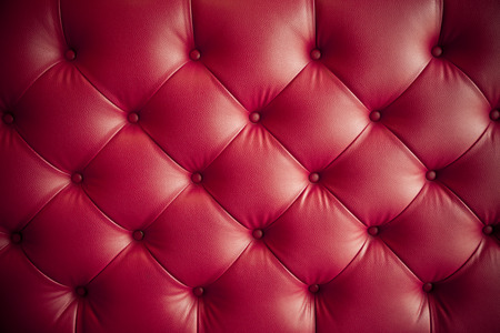 luxury red leather sofa pattern texture backgroundの写真素材