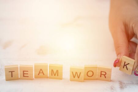 Alphabet Team work on old white vintage wood background