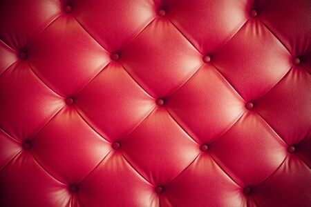 luxury red leather sofa pattern texture backgroundの写真素材