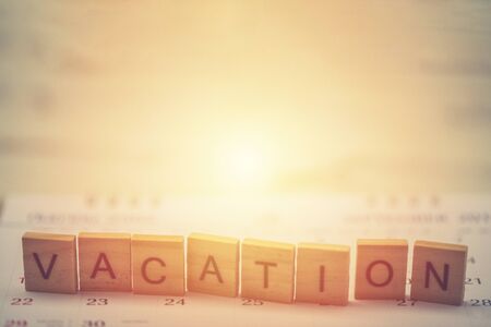 Alphabet Vacation on old vintage wood backgroundの写真素材