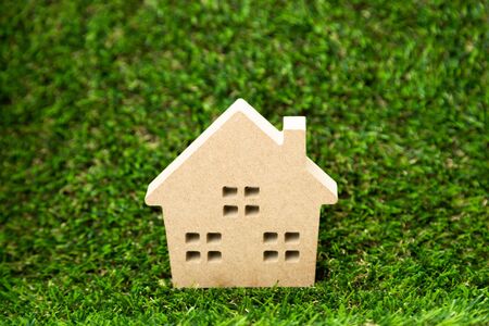 Small wooden house on artificial grass as a top view backgroundの写真素材