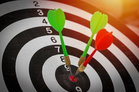 Success hitting target goal achievement  three darts arrows in the target center business goal...