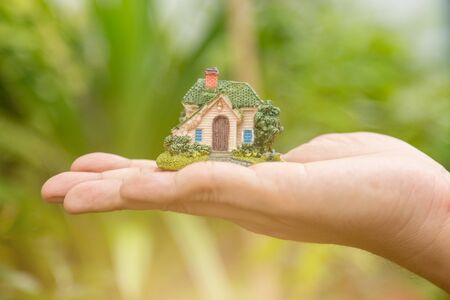 Choosing the right Investment in real estate property with blurred natural backgroundの写真素材