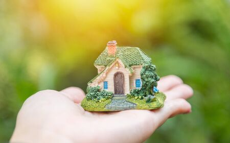 Choosing the right Investment in real estate property with blurred natural backgroundの写真素材