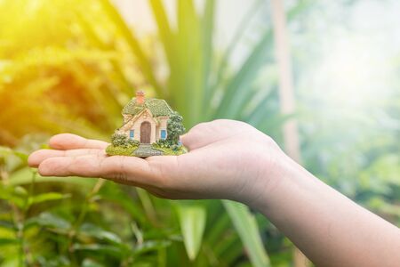 Choosing the right Investment in real estate property with blurred natural backgroundの写真素材