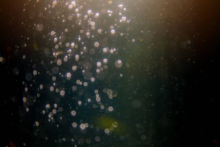 Abstract black defocus bokeh glitter vintage lights with black backgroundの写真素材