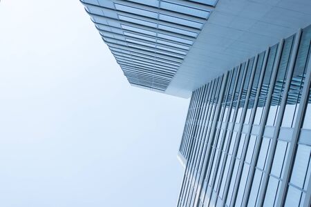 glass modern building business center with blue sky background