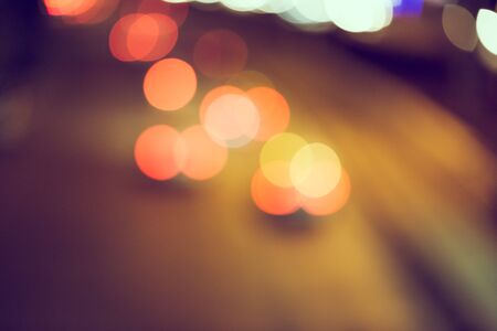 Abstract defocus of bokeh light traffic in the city background