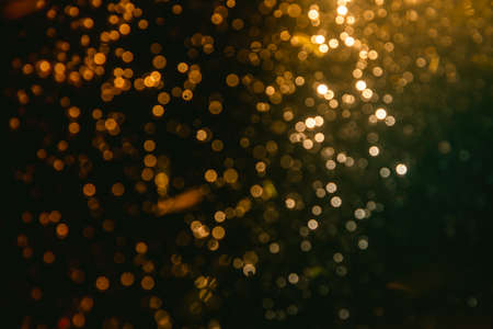 Fantasy Abstract blur golden bokeh of lights colorful sparkle use for backgroundの写真素材