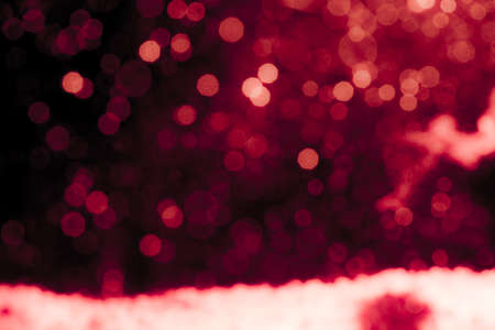 Abstract decorat  bokeh holiday christmas glowing lights on black backgroundの写真素材