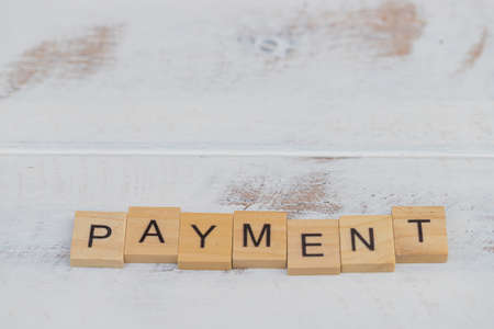 Payment wooden letters on wood vintage backgroundの写真素材
