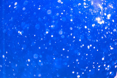 Blue aqua in swimming pool  with bokeh background
