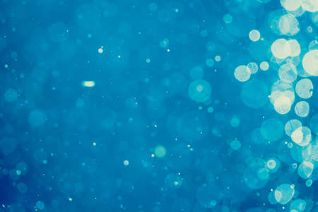 Abstract blur blue bokeh circles use for colorful art and design backgroundの写真素材