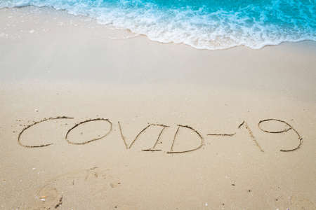 Be safe from COVID-19 with background on the beachの写真素材