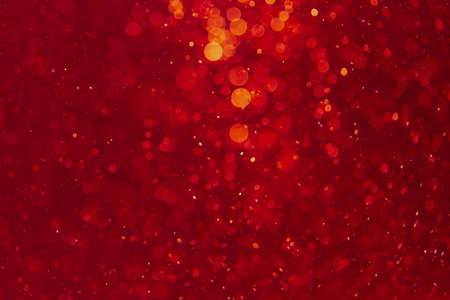 Red bokeh of lights on black backgroundの写真素材