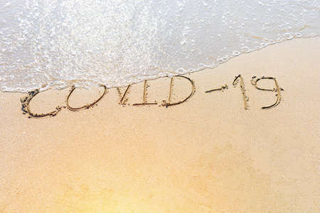 Be safe from COVID-19 with background on the beachの写真素材