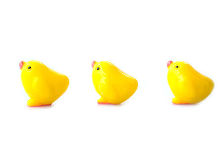 Plastic little yellow chicken on white backgroundの写真素材
