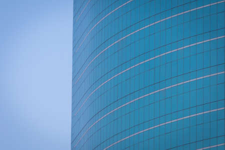 Close up luxury modern building Office with blue sky backgroundの写真素材