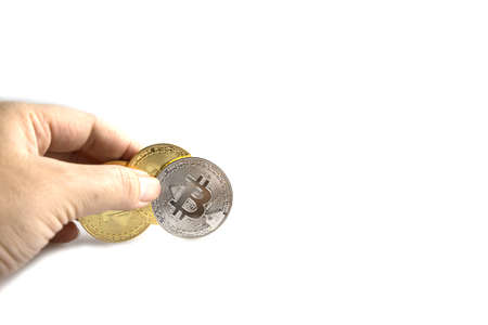 Business hand to pick up bitcoins on white background