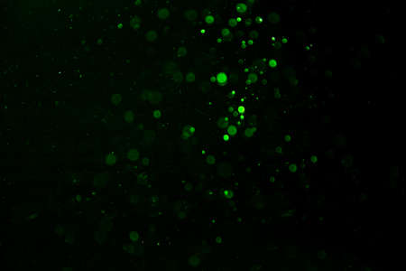 green bokeh natural on black background