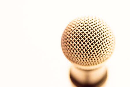 Close up of microphone on a podium in an auditorium with vintage backgroundの写真素材
