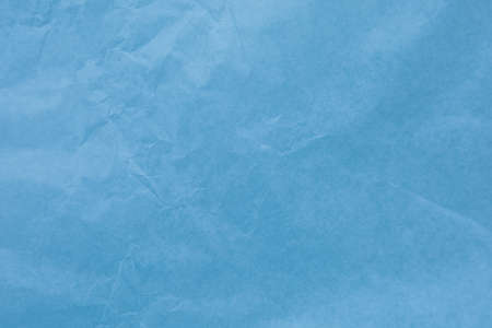 Blue paper with wrinkles texture backgroundの写真素材