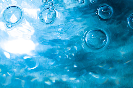 Water bubbWater bubbles abstract bokeh light in the pool backgroundles abstract bokeh light in the...