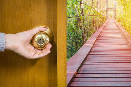 Handle the knob to open the door to entering an Office backgroundの写真素材