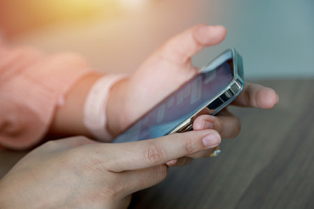Close up women using mobile smartphone for communicationの写真素材