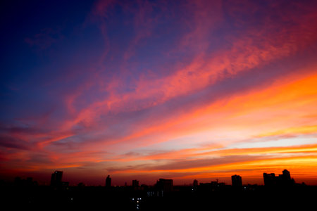 Blur image of Sunset sky with city in the shadow backgroundの写真素材