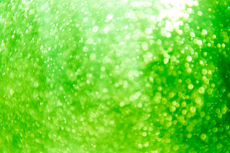 green bokeh natural on black backgroundの写真素材