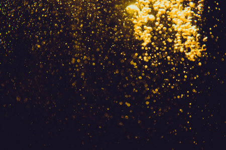 Abstract gold bokeh luxury with black backgroundの写真素材