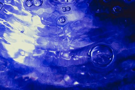 Water bubbWater bubbles abstract bokeh light in the pool backgroundles abstract bokeh light in the pool backgroundの写真素材