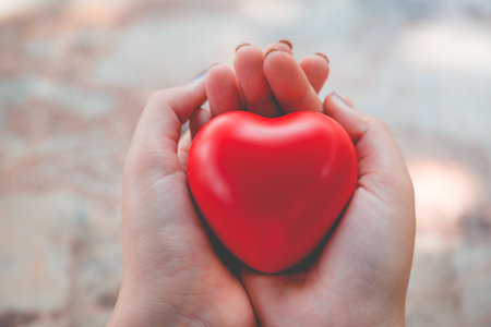 Woman hold red heart use for backgroundの写真素材