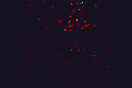 Red bokeh of lights on black backgroundの写真素材