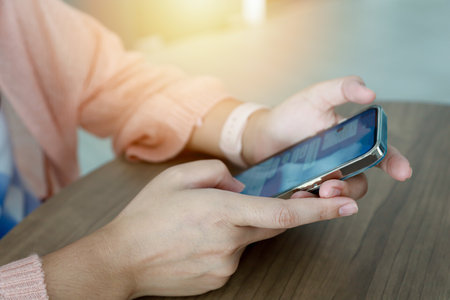 Close up women using mobile smartphone for communicationの写真素材