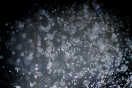Abstract white bokeh with blue backgroundの写真素材