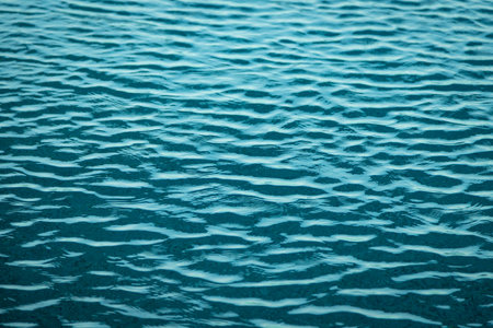Light Blue swimming pool rippled water texture reflectionの写真素材