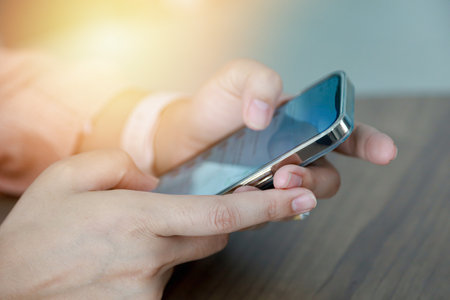 Close up women using mobile smartphone for communicationの写真素材