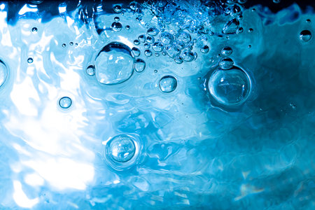 Water bubbWater bubbles abstract bokeh light in the pool backgroundles abstract bokeh light in the...