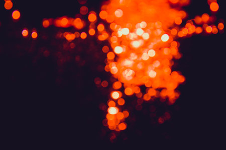 Red bokeh of lights on black backgroundの写真素材