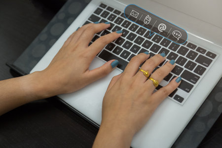 concept business man using computer keyboard with email, phone, address, chat message icon customer support hotline contact us people connectionの写真素材