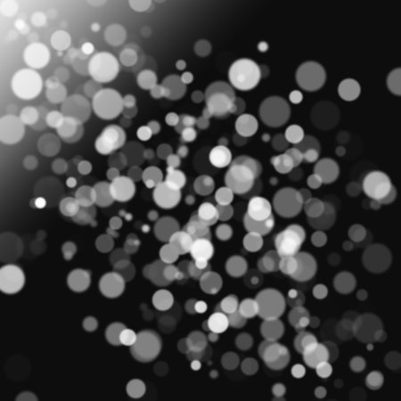 Abstract white bokeh with black backgroundの写真素材