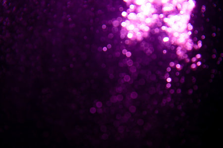 Abstract purple bokeh glitter lights defocused backgroundの写真素材